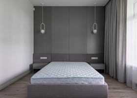 ANASAYFA Comfortable bed with convenient modern mattress in contemporary interior of spacious gray bedroom