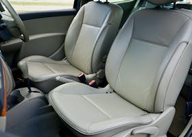 ANASAYFA Spacious car interior featuring contemporary leather seats and a steering wheel.